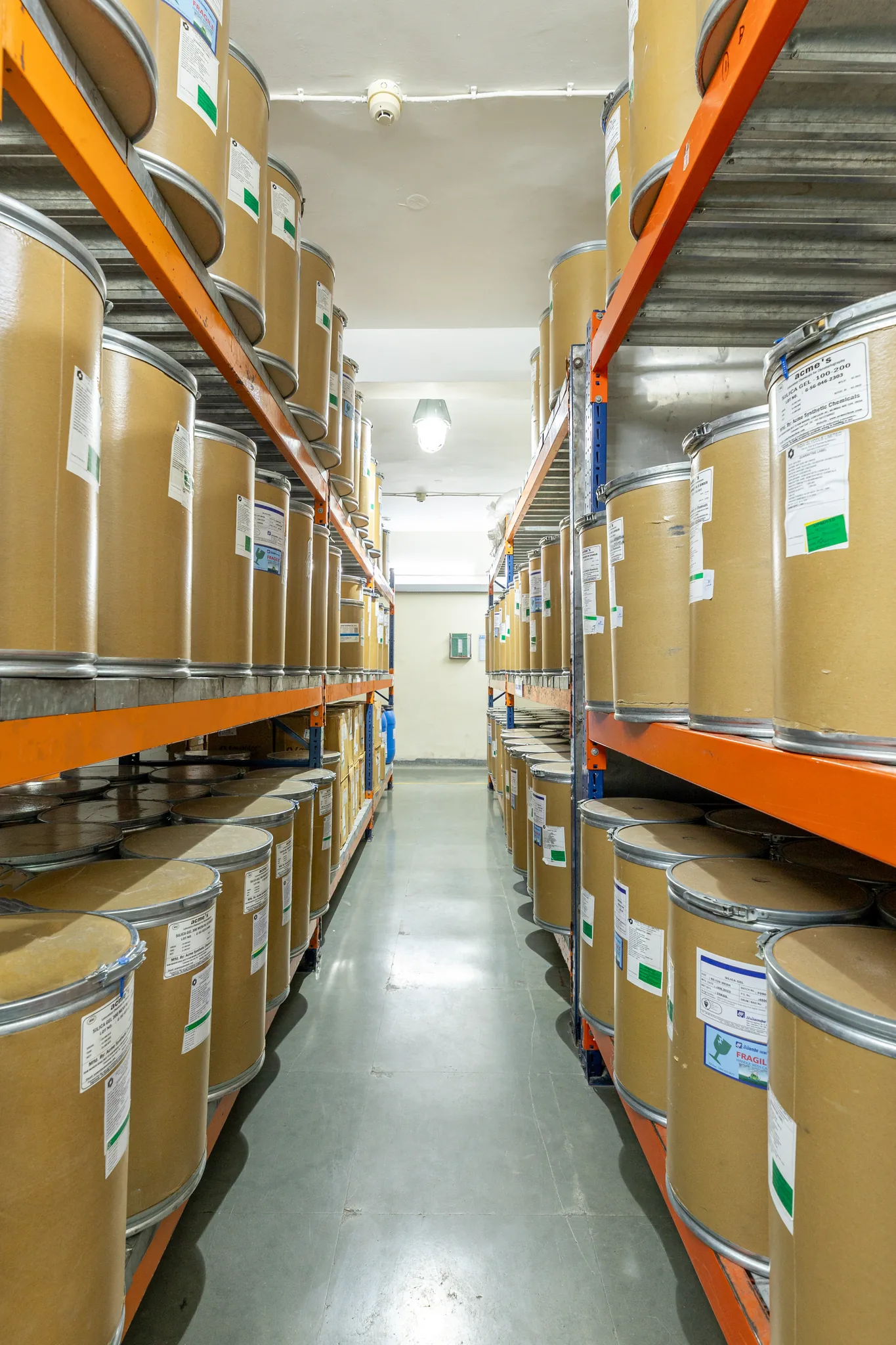 Finished ingredient drums in the warehouse racking
